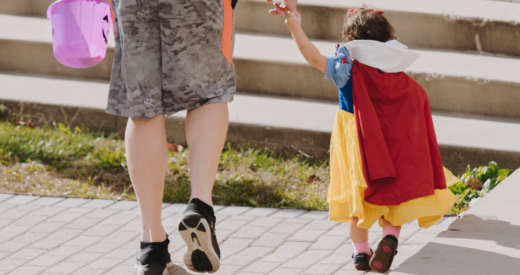 Man trick or treating with his daughter dressed as Snow White