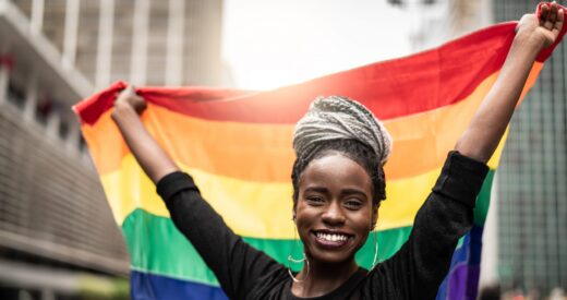 Woman Waving Rainbow Flag at Gay Parade