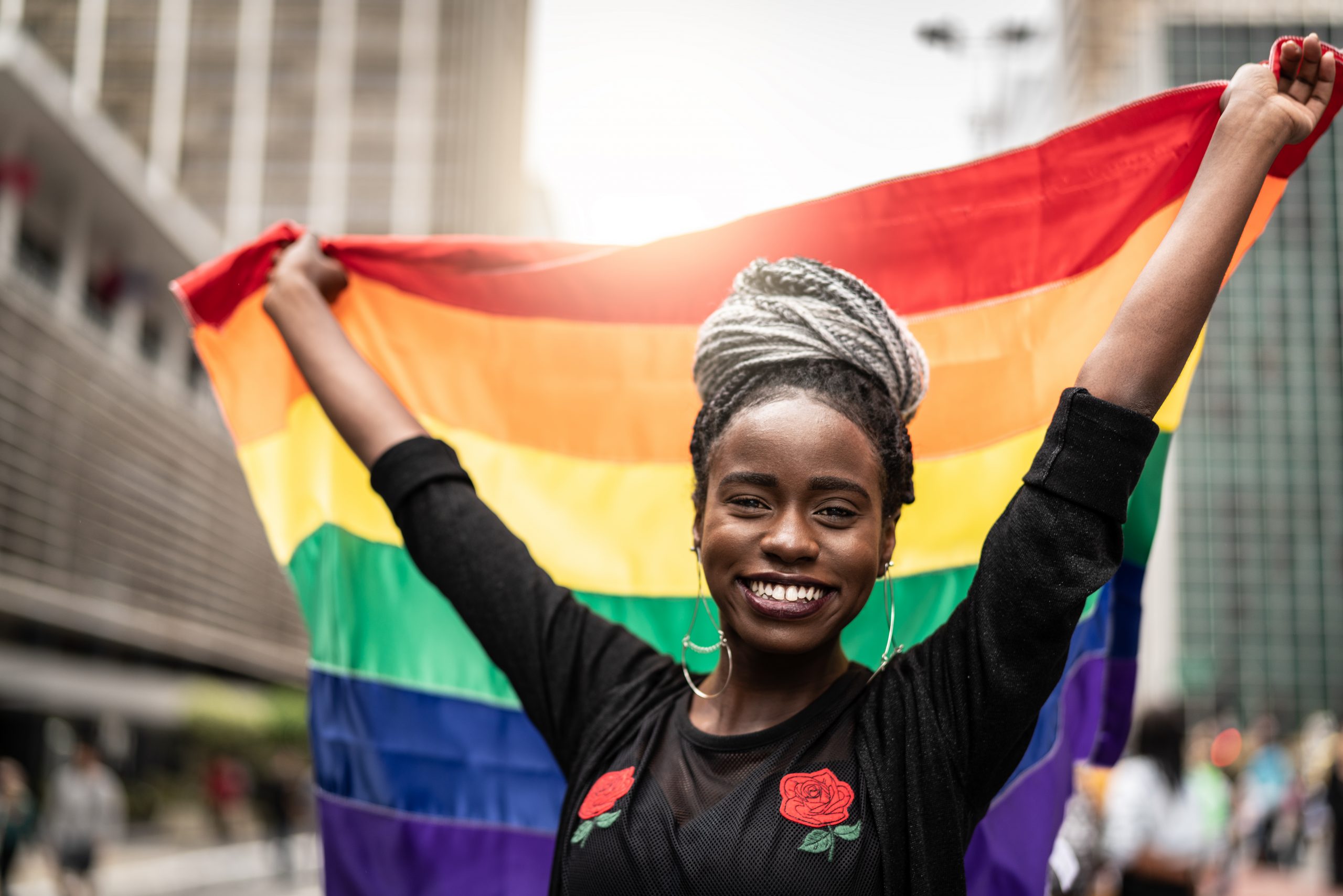 Woman Waving Rainbow Flag at Gay Parade