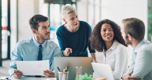 Multi-ethnic group of business persons talking in the office