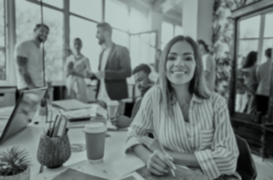 Smiling female employee sit in coworking space and working on the project. Front view