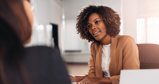 Young woman doing a job interview in the office and talking with client