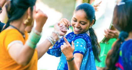 Indian women dancing to celebrate