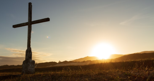 Cross in front of sunset in Florianópolis, SC, Brasil