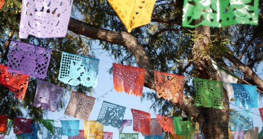 Colorful mexican perforated papel picado banner, festival colourful paper garland.