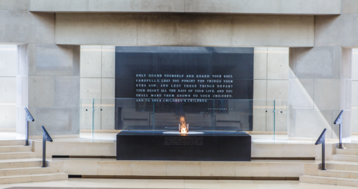 Eternal flame on top of block holding dirt from concentration camps in Europe in the Hall of Remembrance inside US Holocaust Memorial Museum in Washington, DC