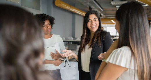 Businesswomen having informal conversation meeting in office