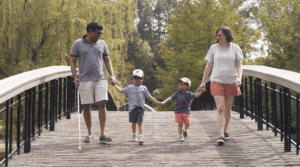 John Samuel and family walking outside