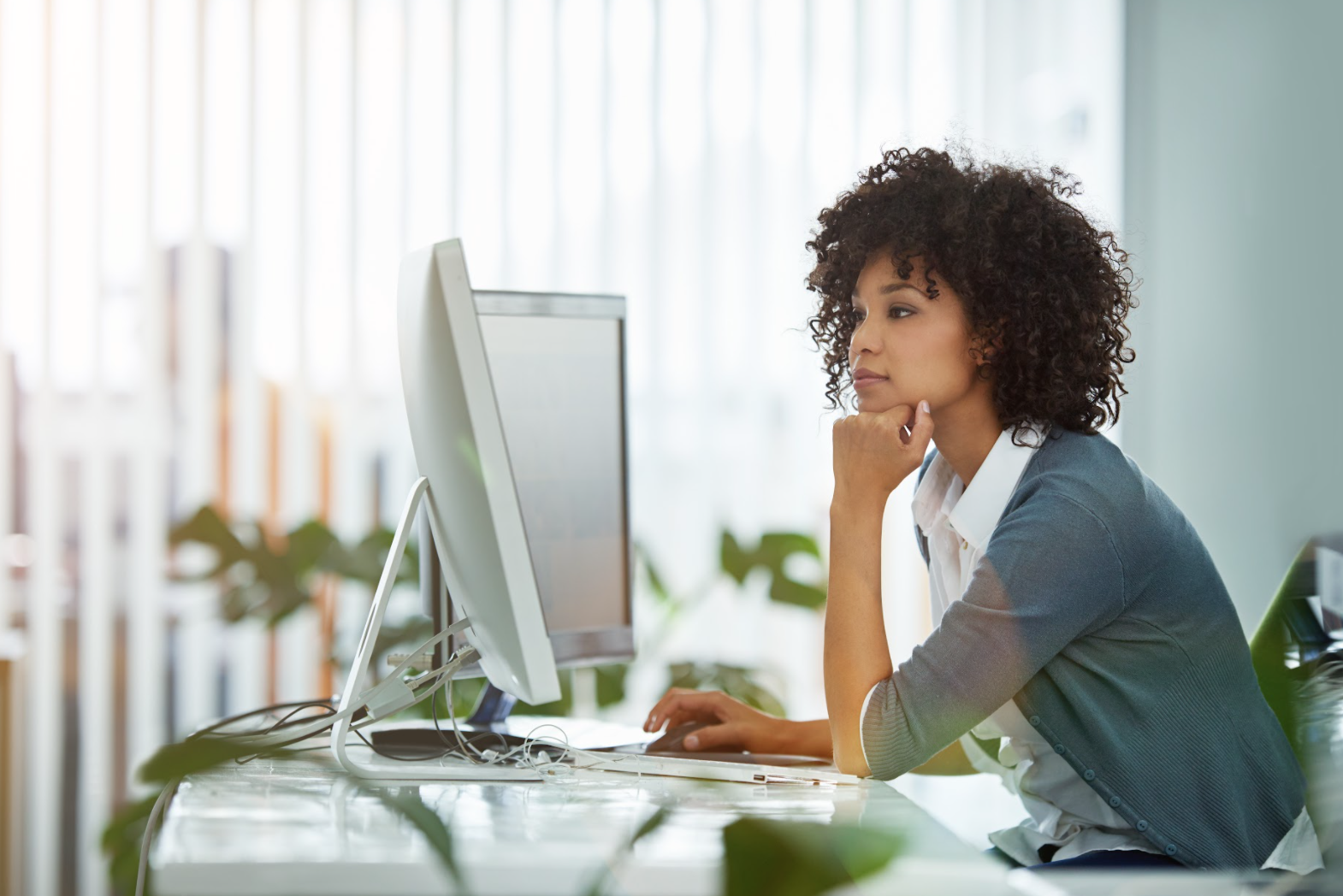 Woman sitting looking at computer