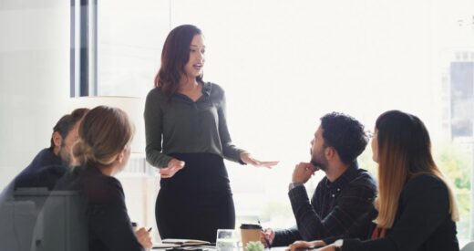 Stock photo of a woman leading a workplace presentation