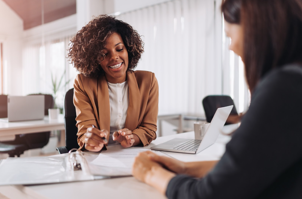 Female client consulting with a agent in the office