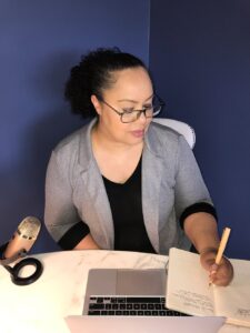 Jackie sitting at her desk and working