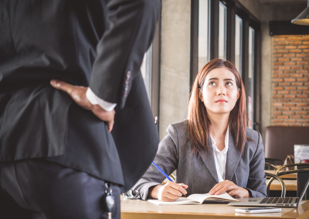 Aggressive/angry boss complaining asian business woman(casual uniform) in cafe office