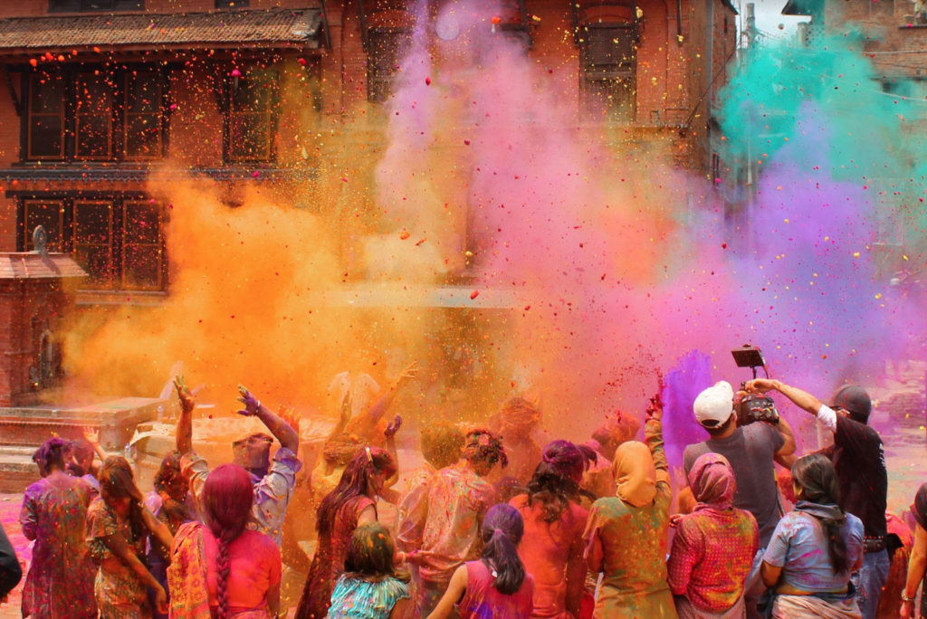 Bhaktapur, Nepal - March 12, 2014: Group of people celebrating the festival of colors Holi which is very famous in Nepal and India