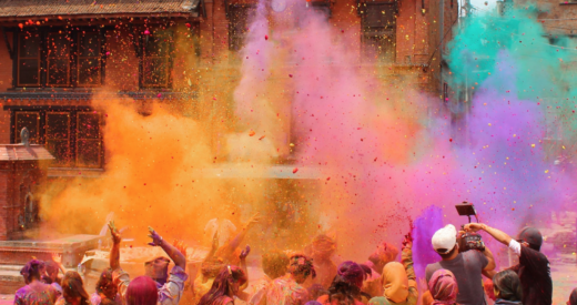 Bhaktapur, Nepal - March 12, 2014: Group of people celebrating the festival of colors Holi which is very famous in Nepal and India