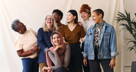 Portrait of cheerful mixed age range multi ethnic women celebrating International Women's Day stock photo