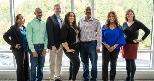 Group shot of the leadership team including Kristie Davis, Kurt Merriweather, Bob Batchelor, Jackie Ferguson, Donald Thompson, Shelley Willingham, and Jamie Ousterout