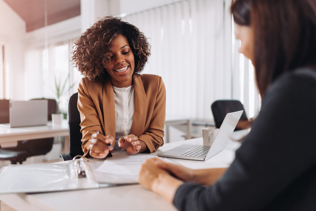 Female client consulting with a agent in the office