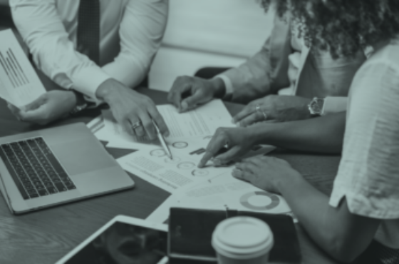 diverse employees working at a table