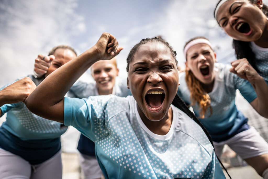 Portrait of a female soccer team celebrating