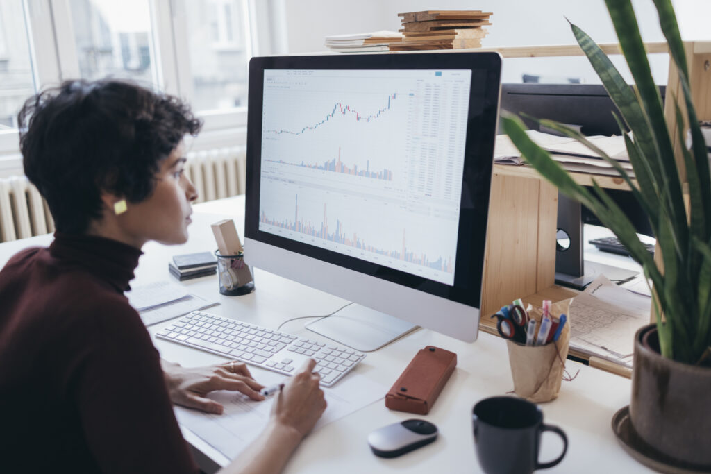 A Hardworking Latin-American Businesswoman Watching At Some Data And Gathering Some Information