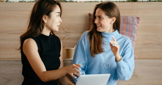 two female corworkers having a discussion