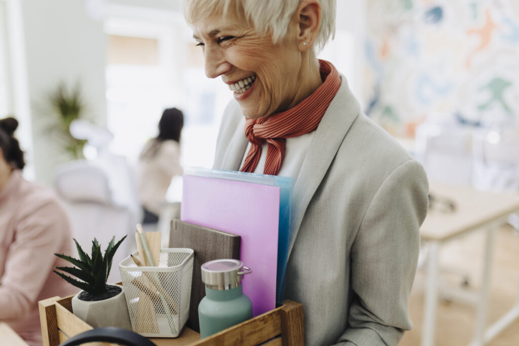 Resignation concept. Businesswoman packing personal company belongings when she deciding resignation change of job or fired from the company or retirement