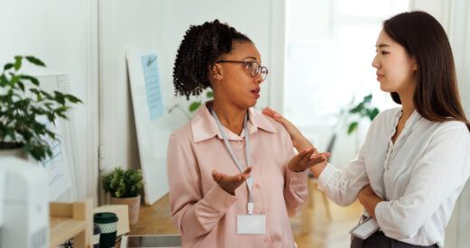 Woman consoling her colleague at the office