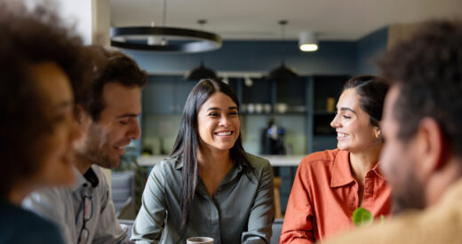 Happy Latin American businesswoman smiling in a meeting at the office