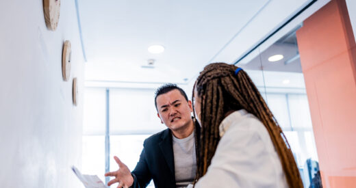 Mid adult leader man complaining to employee at office