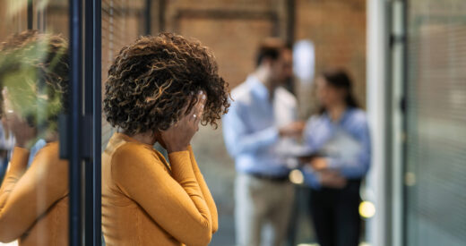 Photo of female Worker having headache. Dark-haired office worker having headache after been fired from work for no reason.